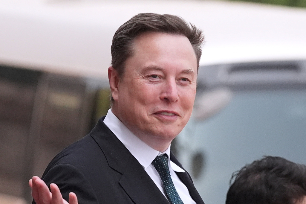 FILE - Elon Musk departs after a welcome ceremony with President Donald Trump and China's President Xi Jinping at the Great Hall of the People, Thursday, May 14, 2026, in Beijing.