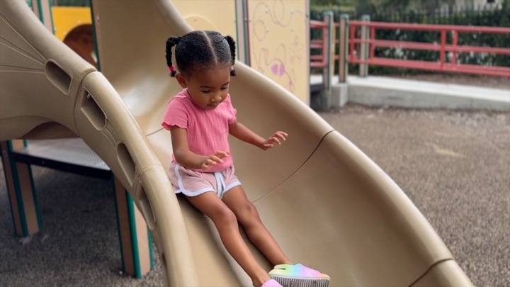 Child playing on slide