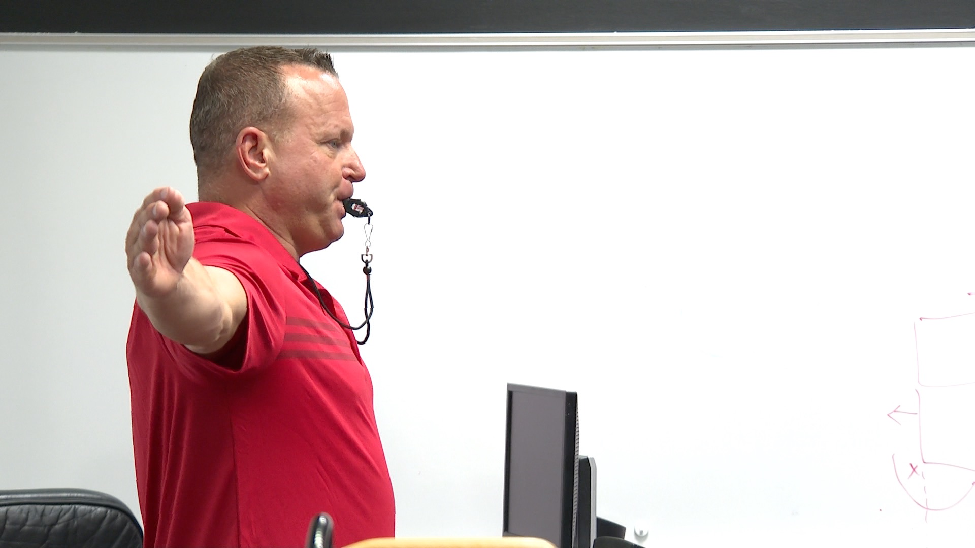 Craig Wiedel teaching a volleyball officiating clinic in July 2025
