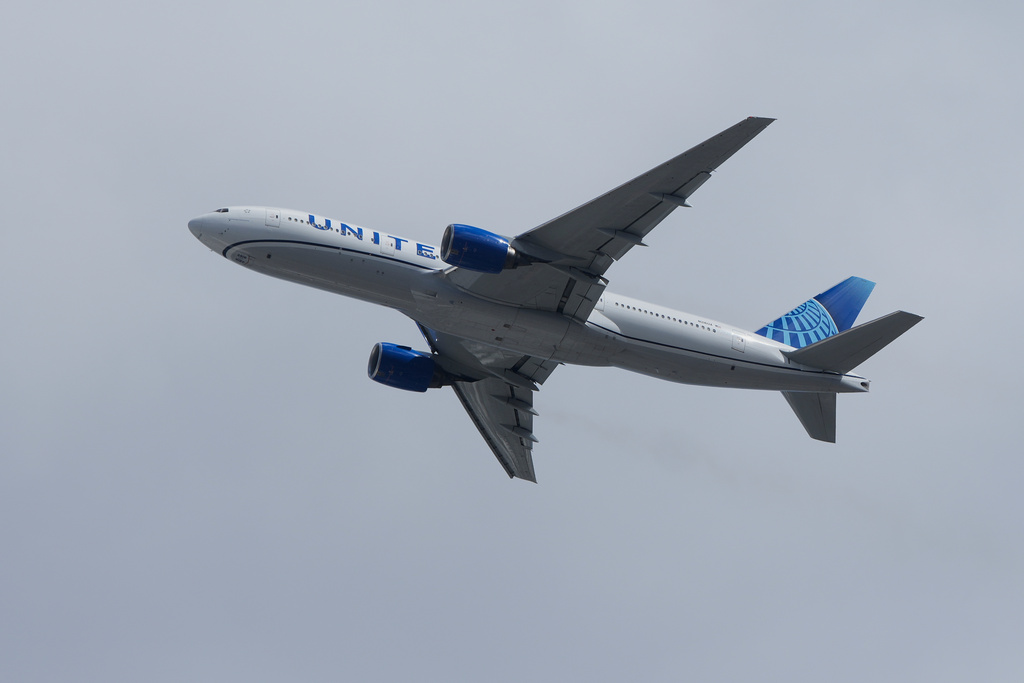 A United Airlines plane is shown flying in San Bruno, Calif., Tuesday, Sept. 30, 2025. 