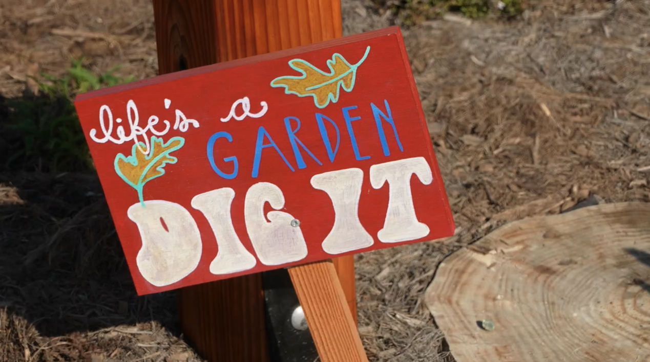 life's a garden -- dig it sign