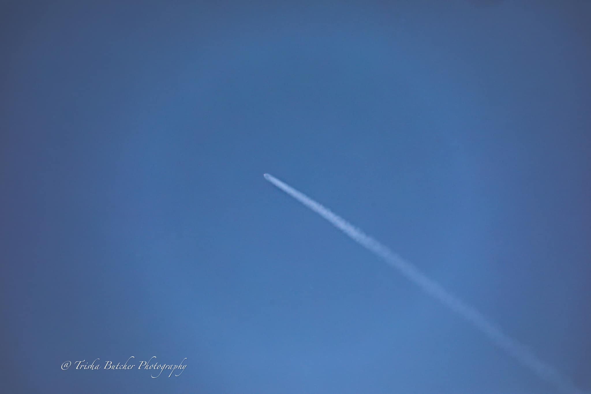 Satellite launch with clear blue skies