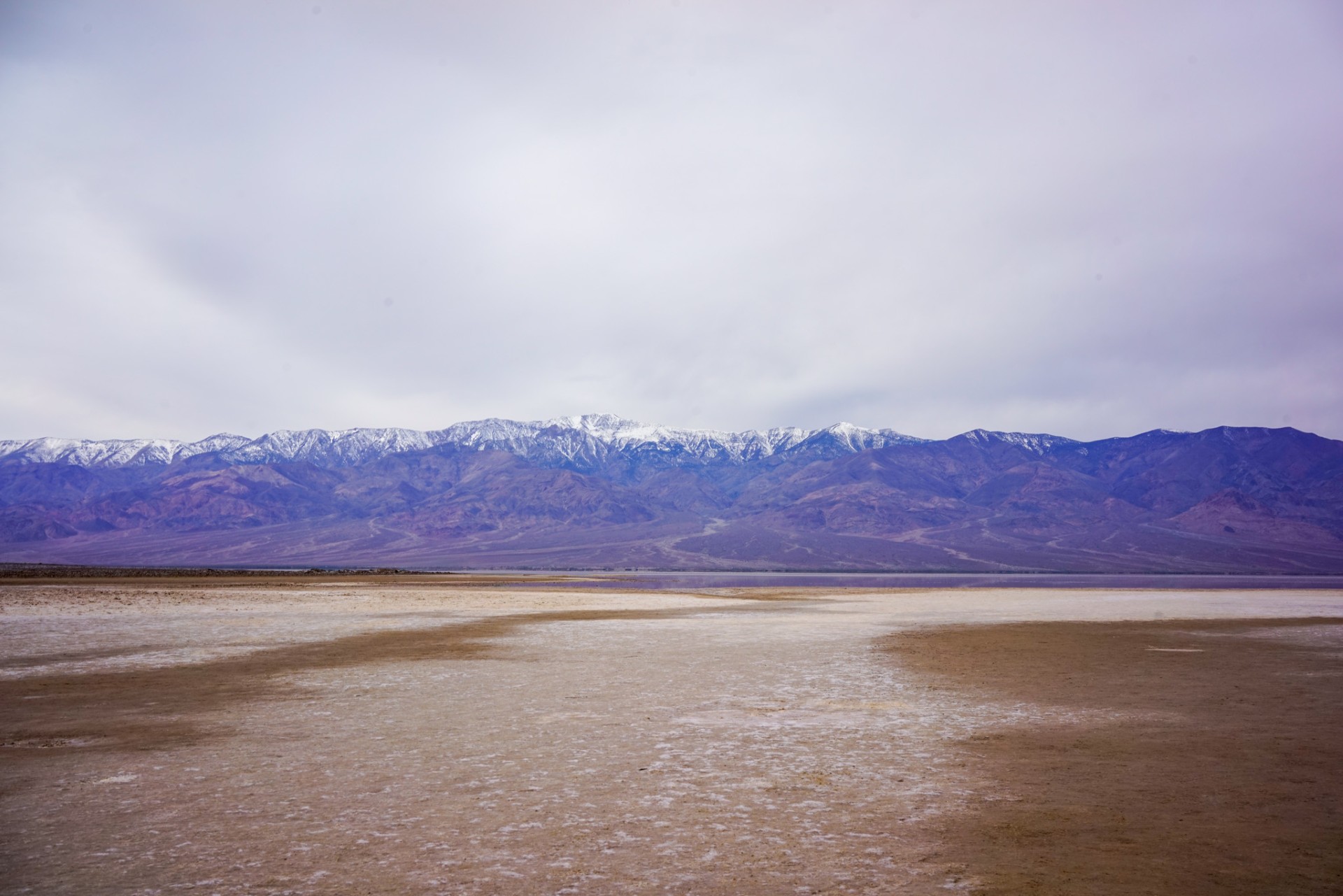 The calm still water in Badwater Basin sometimes referred to as Lake Manly. The water is very shallow and a one mile walk from the parking lot.
