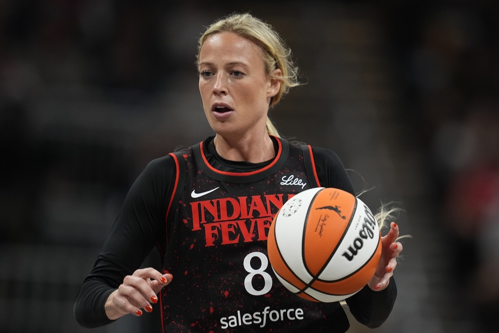 Indiana Fever's Sophie Cunningham dribbles during the first half of a WNBA basketball game.