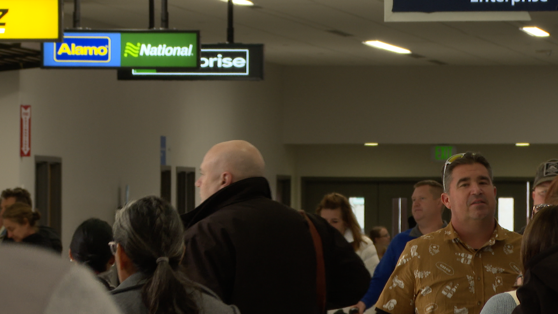 A traveler leaves the airport
