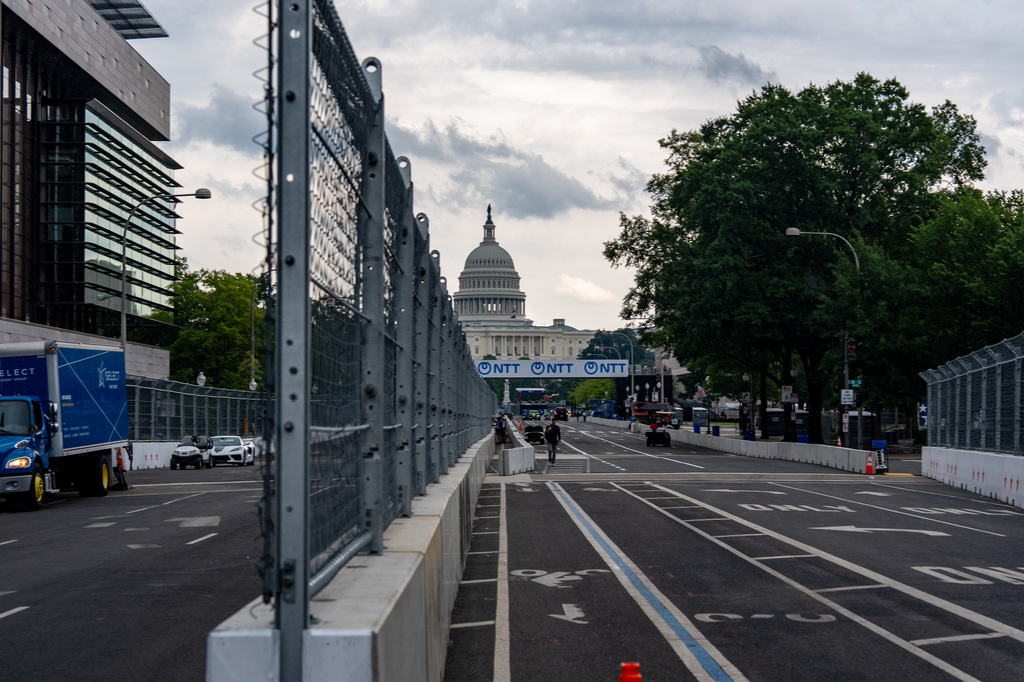 Fencing is in place on Pennsylvania Avenue with the U.S. Capitol in the background ahead of the Freedom 250 Grand Prix, Thursday, Aug. 20, 2026, in Washington.