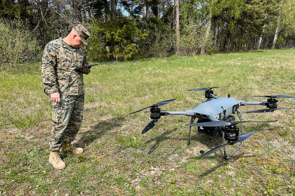 A U.S marine serviceman stands next to a TRV 150 drone during a military exercises in Gotland, Sweden, Monday, May 11, 2026.