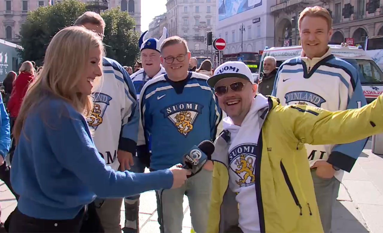 WPTV anchor Meghan McRoberts speaks to Finland hockey fans in Milan on Feb. 10, 2026.