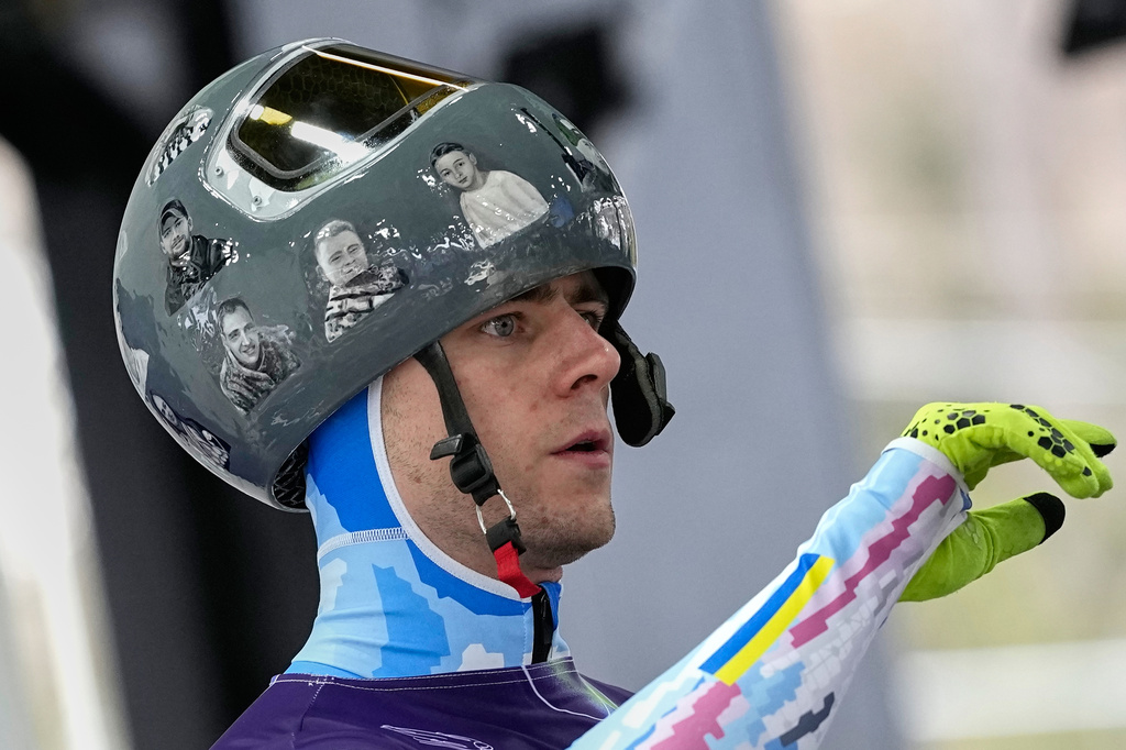 Ukraine's Vladyslav Heraskevych arrives at the finish during a men's skeleton training session at the 2026 Winter Olympics, in Cortina d'Ampezzo, Italy, Tuesday, Feb. 10, 2026. 