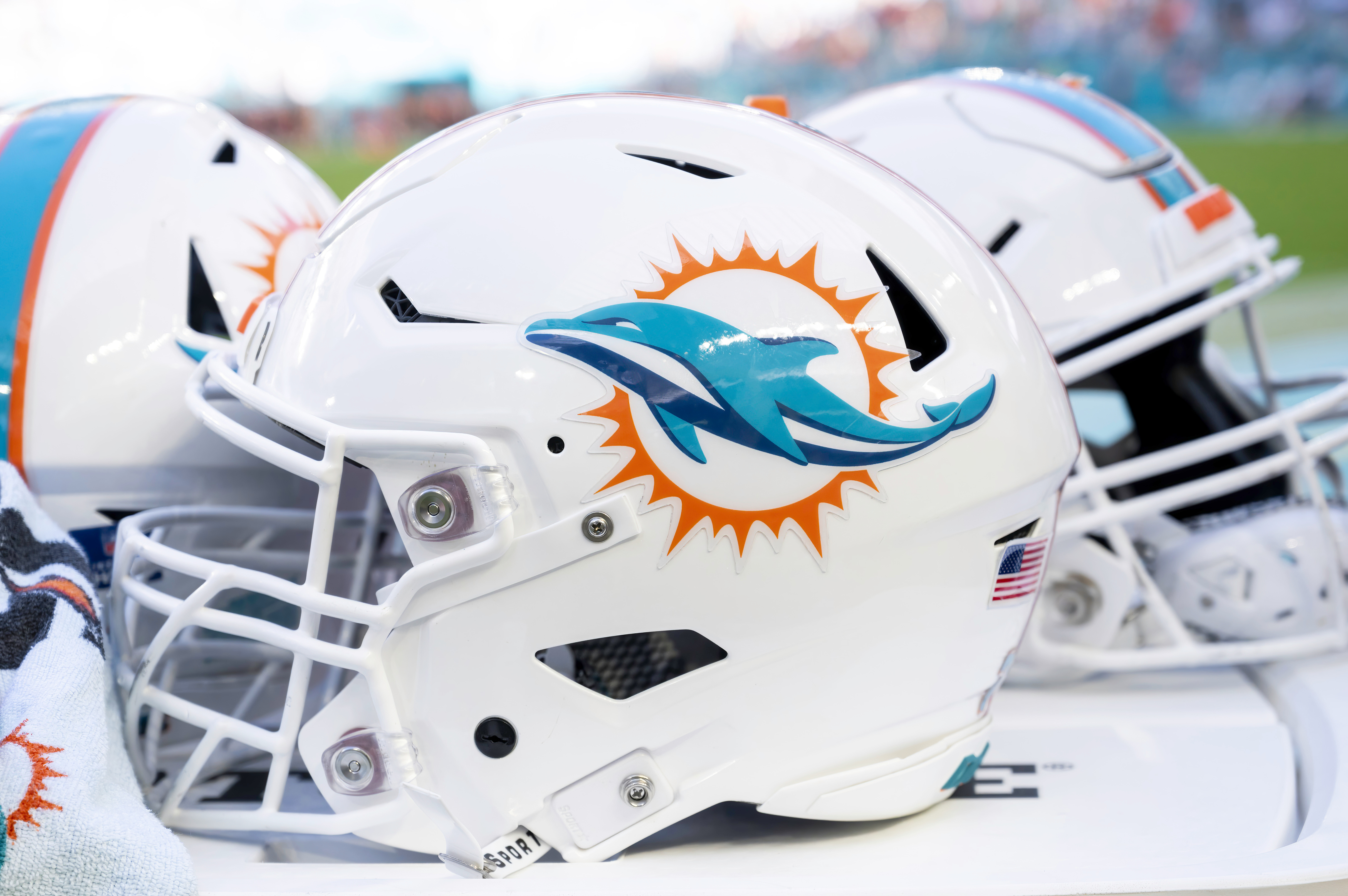 Miami Dolphins helmets on sideline in 2023