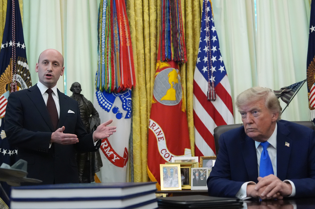 President Donald Trump listens as White House deputy chief of staff for policy Stephen Miller speaks in the Oval Office of the White House, Thursday, Aug. 6, 2026, in Washington. 