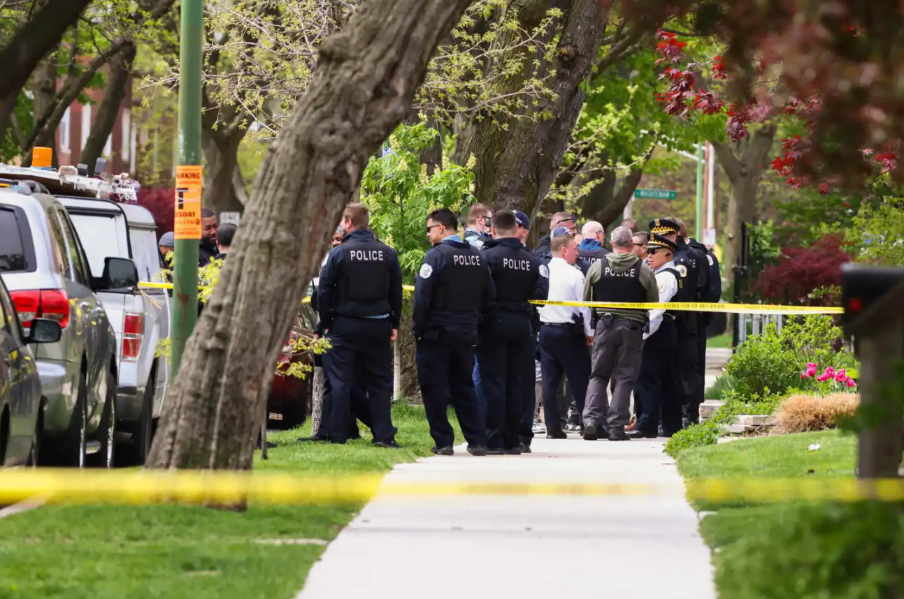 Police officers work the scene outside Endeavor Health Swedish Hospital in Lincoln Square, on Saturday, April 25, 2026.