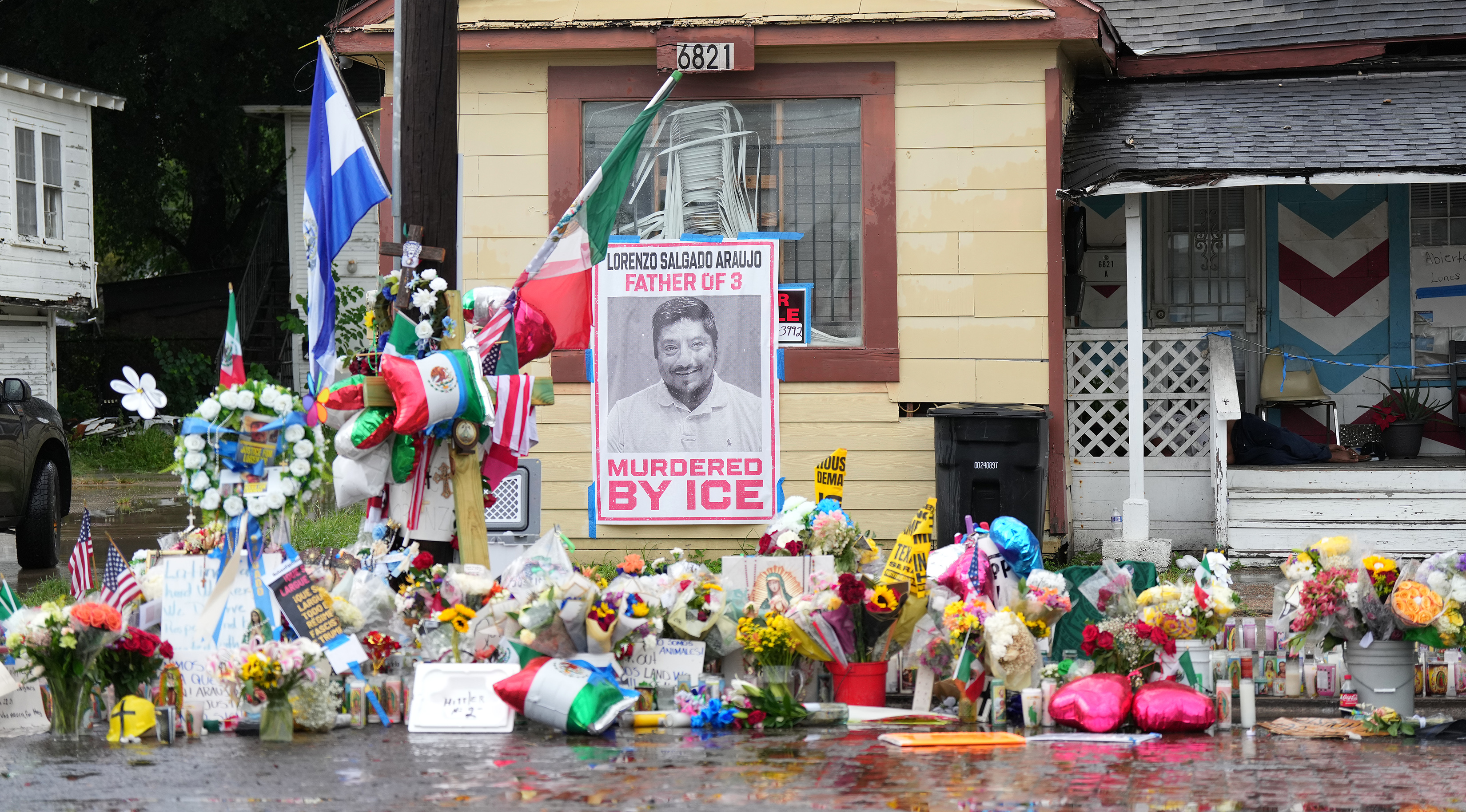 A growing memorial at the site where Lorenzo Salgado Araujo was fatally shot by ICE agents last week, is seen Monday, July 13, 2026, in Houston.