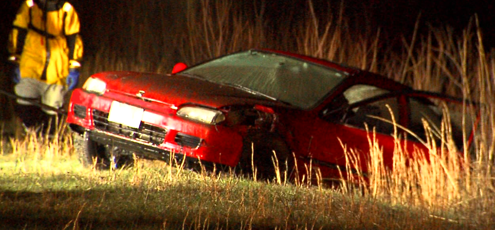 Car submerged in retention pond
