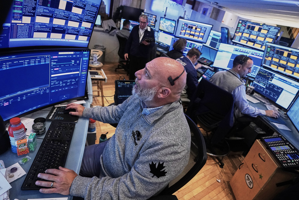 Trader Vincent Napolitono, foreground, works on the floor of the New York Stock Exchange, Thursday, Nov. 20, 2025.