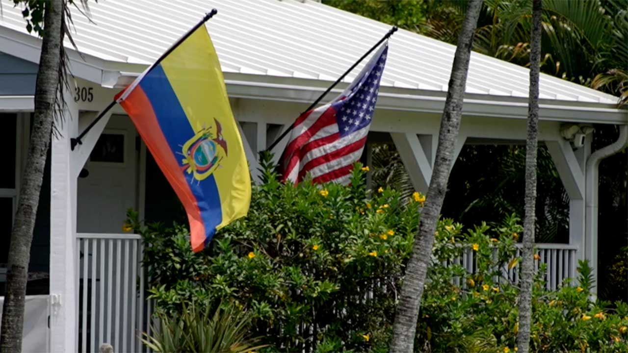 Colombia and American flags outside a home in Greenacres