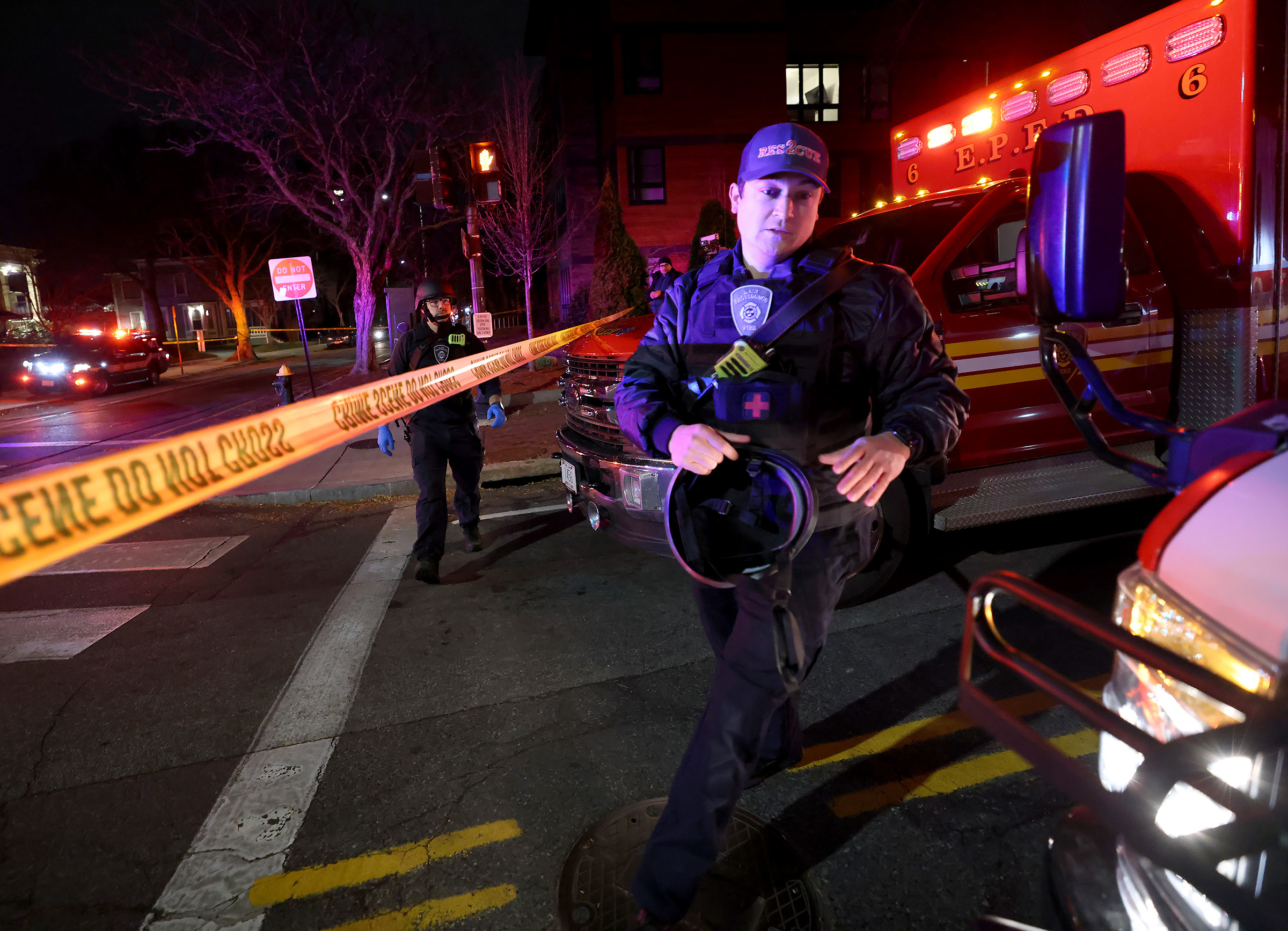 Emergency personnel gather on Waterman Street at Brown University in Providence, R.I., on Saturday, Dec. 13, 2025, during the investigation of a shooting. 