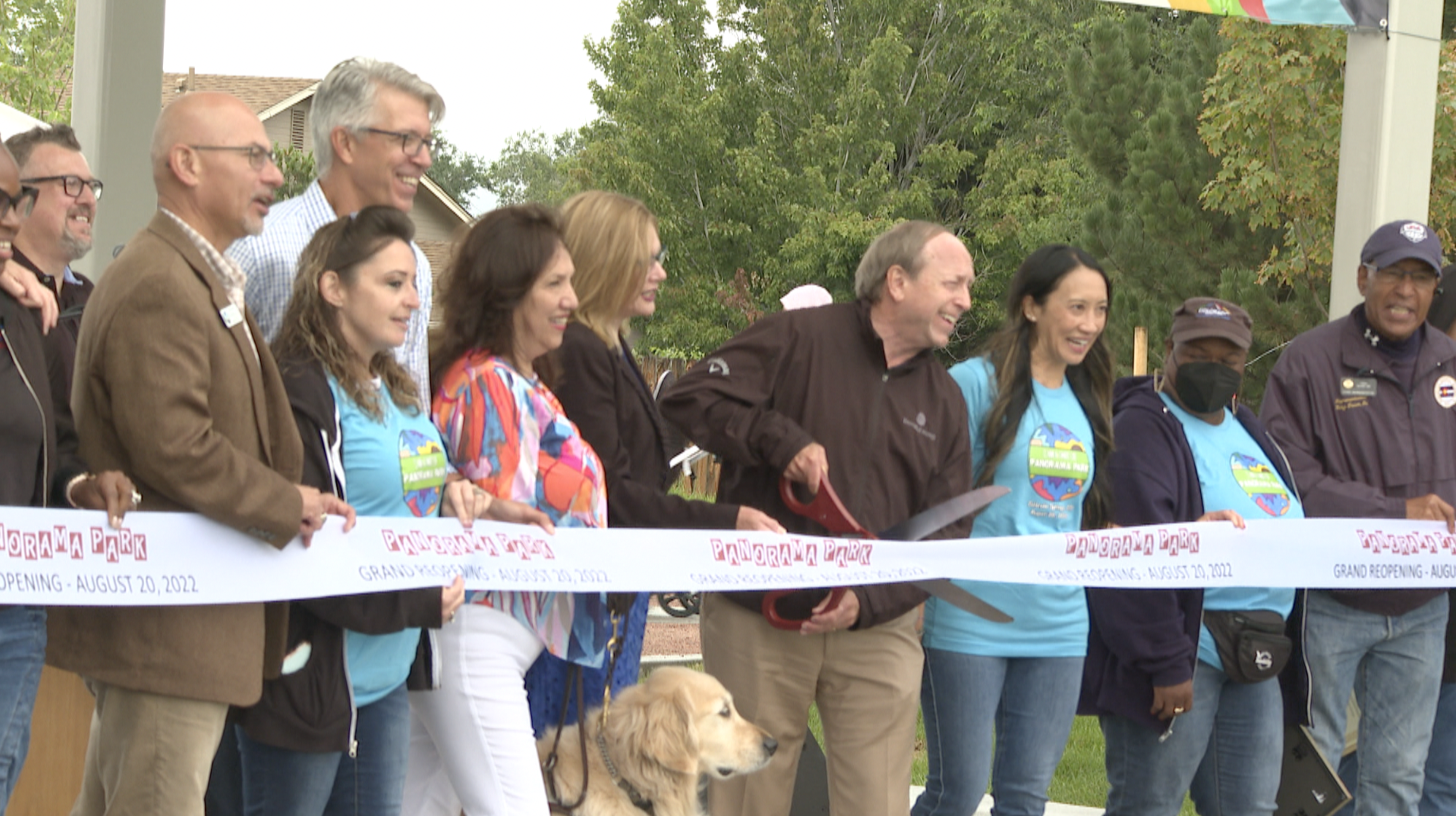 The mayor and others gather to cut the ribbon on Panorama Park's reopening 
