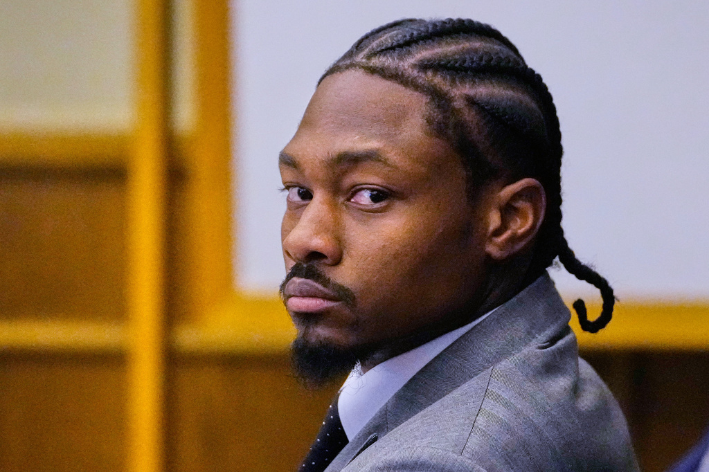 Former New England Patriots wide receiver Stefon Diggs listens to his defense attorney cross examine witness Jamila Adams during his trial at Norfolk County District Court, Tuesday, May 5, 2026, in Dedham, Mass.