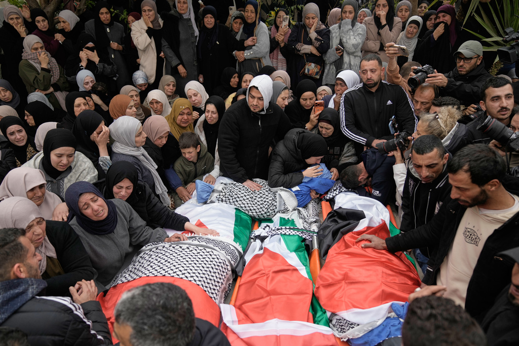 Palestinians mourn at the funeral of four members of the Odeh family who were killed in their car by Israeli security forces during an army operation in Tammun, West Bank, Sunday, March 15, 2026.