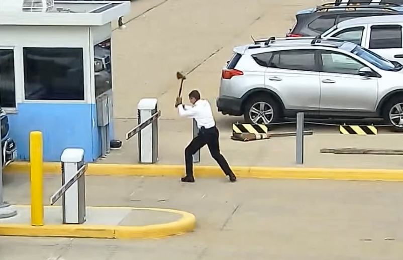 united airlines pilot takes axe to a parking late at dia.png