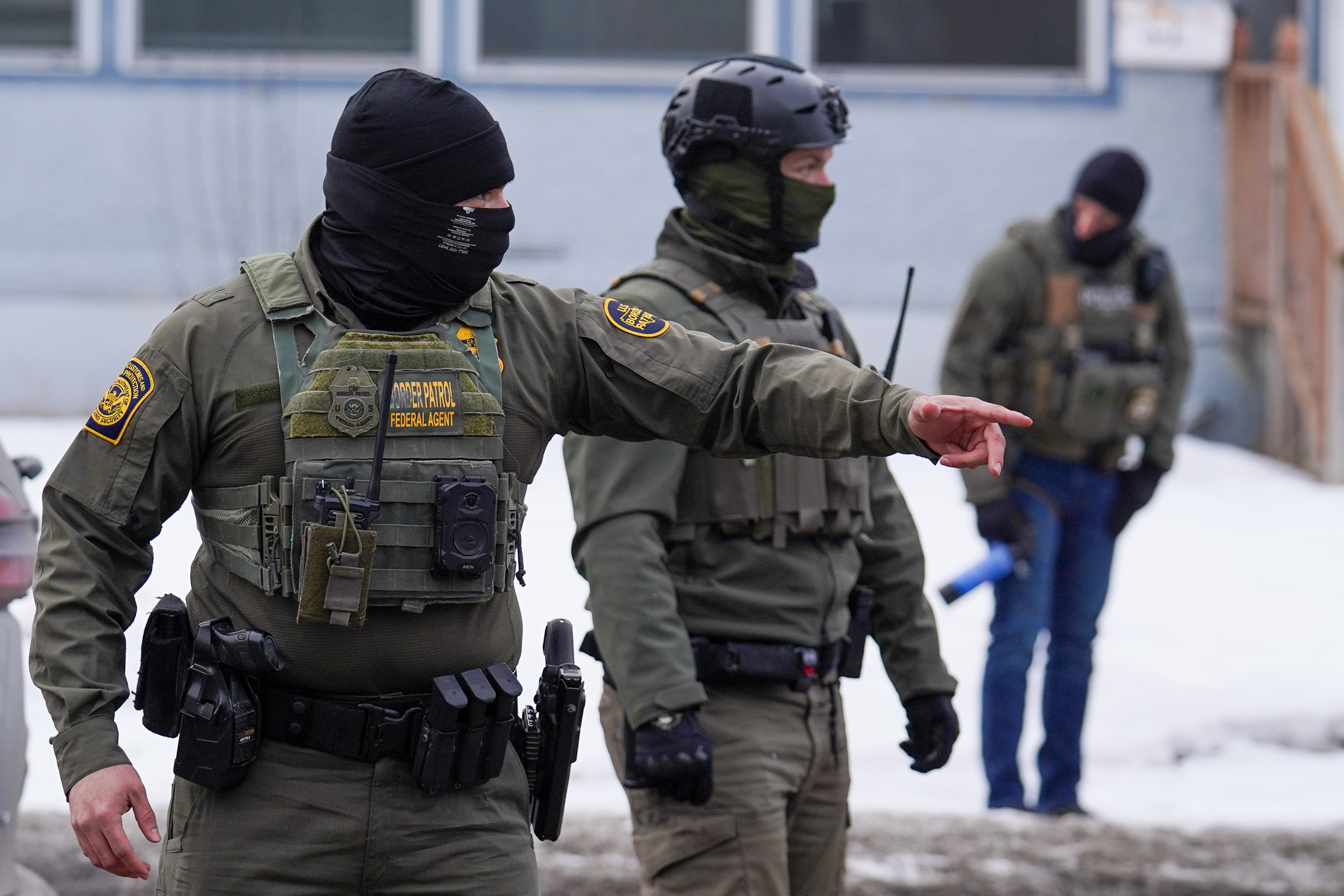 A United States Border Patrol agent gestures to a car while conducting immigration enforcement operations, Thursday, Feb. 5, 2026, in Minneapolis. 