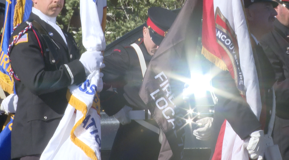 photo of firefighters at memorial
