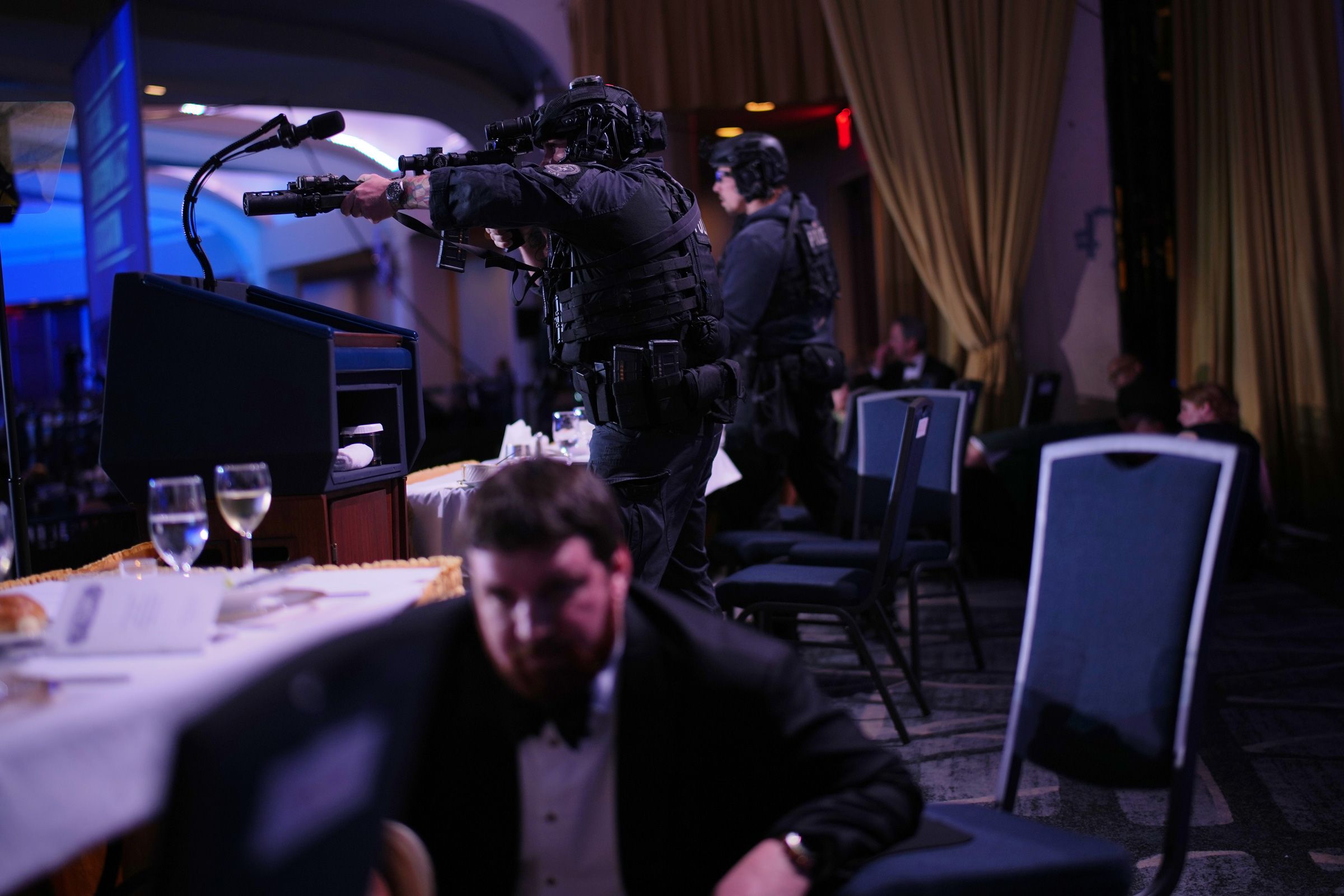 Agents stand guard after President Donald Trump was evacuated from the White House Correspondents' Association Dinner.