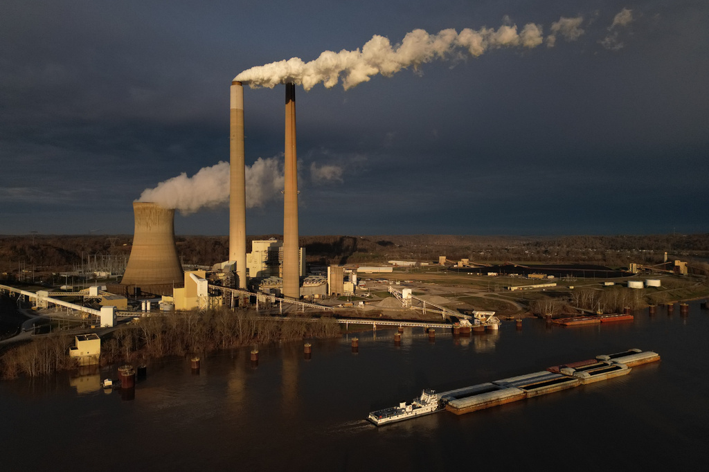 A barge on the Ohio River moves past the Mountaineer Power Plant, a coal-fired power plant near New Haven, W.Va., March 13, 2026. 