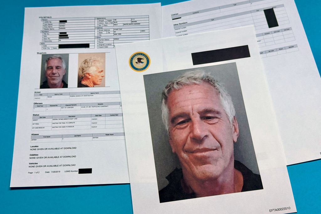 Documents that were included in the U.S. Department of Justice release of the Jeffrey Epstein files are photographed Friday, Jan. 2, 2026. 