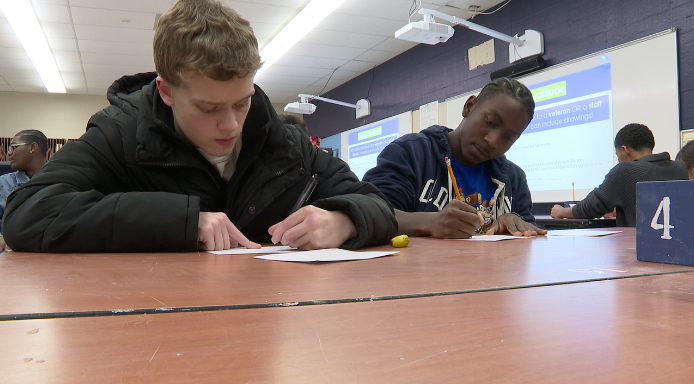 Students writing letters at Grand River Prep