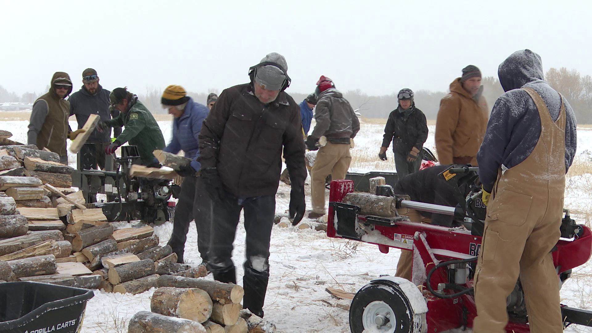 Volunteers cut wood for those in need as temps drop to near zero