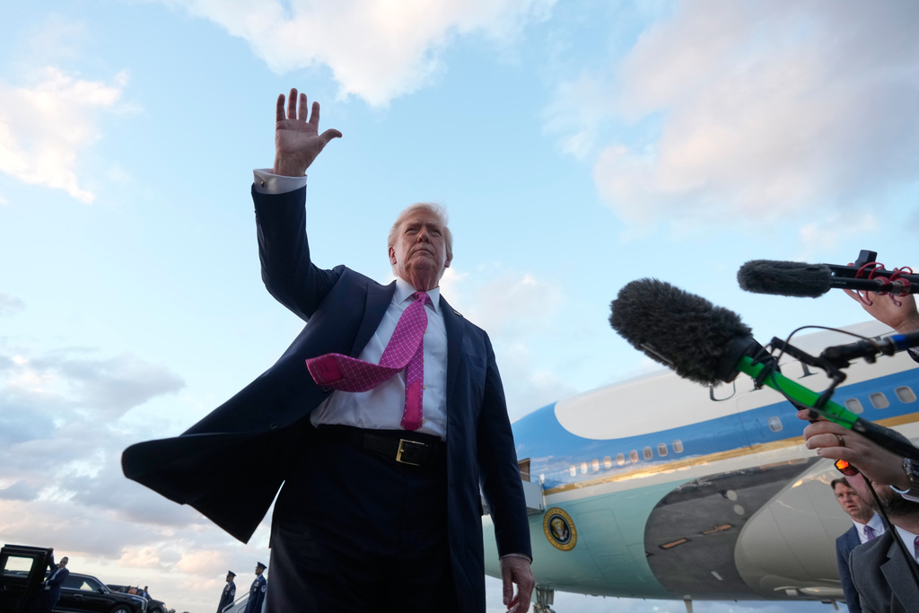 President Donald Trump waves after arriving on Air Force One, Friday, Oct. 17, 2025, at Palm Beach International Airport in West Palm Beach, Fla.