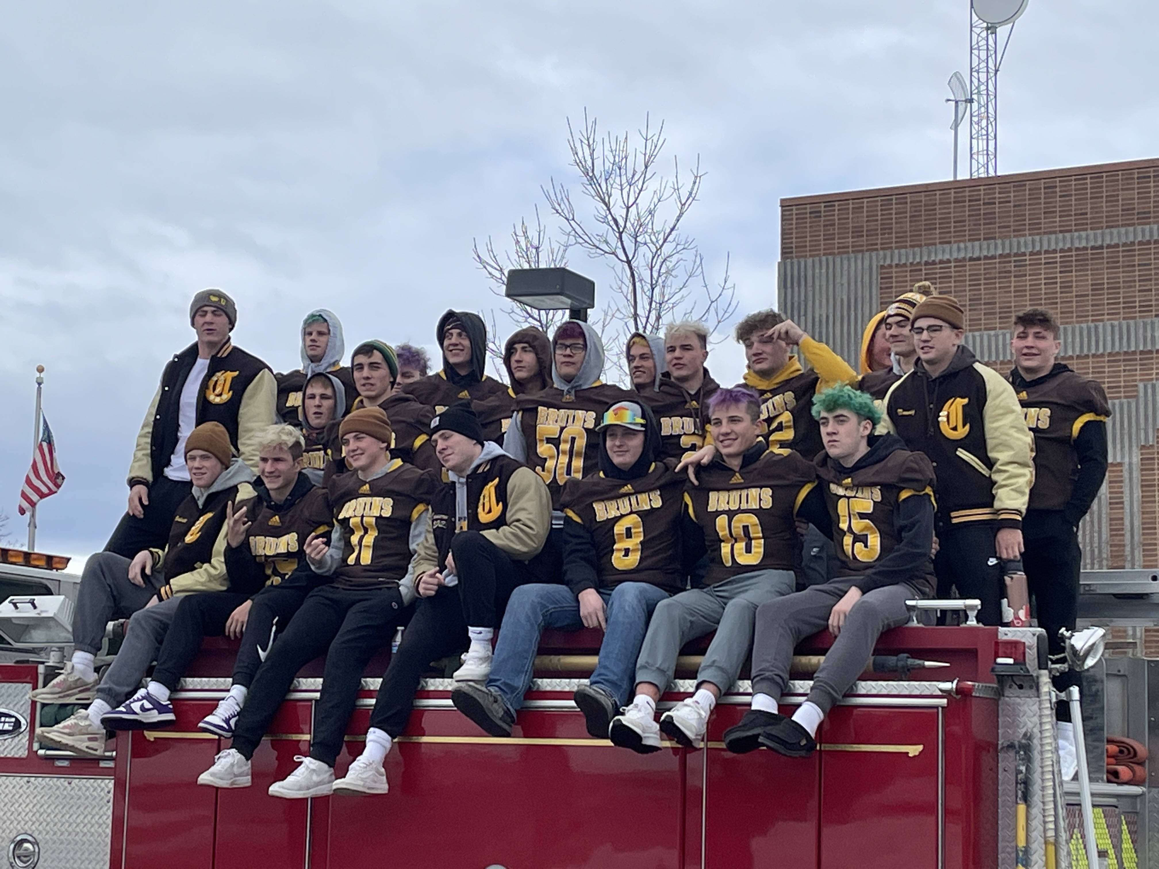 Capital Bruins football celebrates AA state championship with firetruck victory lap
