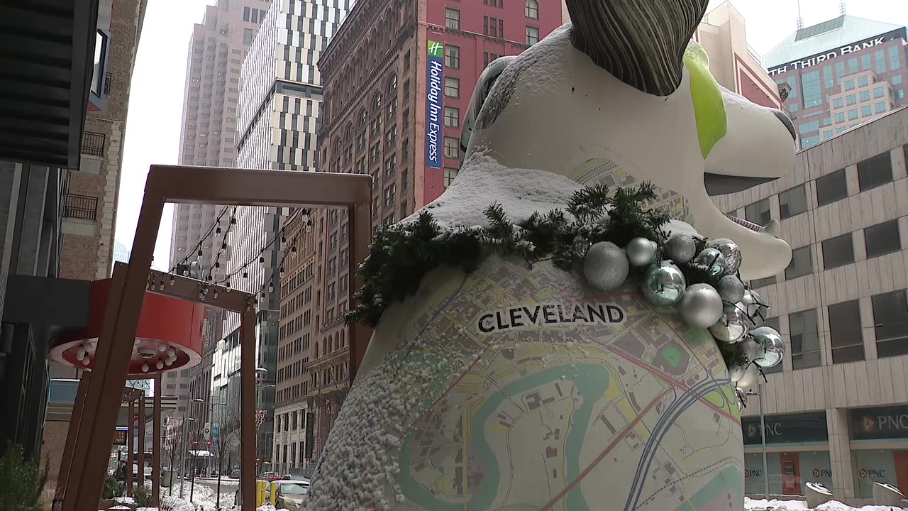A giant dog statue greets passersby outside the door to Dogtopia, a doggy daycare and spa on Euclid Avenue.