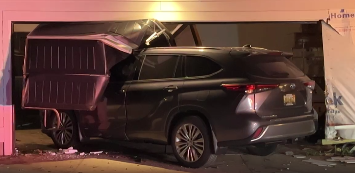 car into garage at Carl and Grand River in Ada