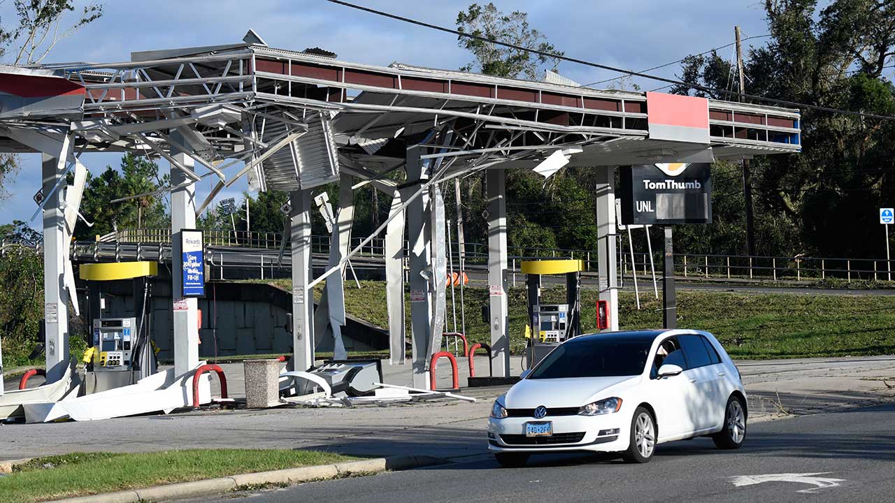 A gas station is damaged by the effects of Isaias on Saturday, Oct. 10, 2026, in East Milton, Fla. (AP Photo/Octavio Jones)