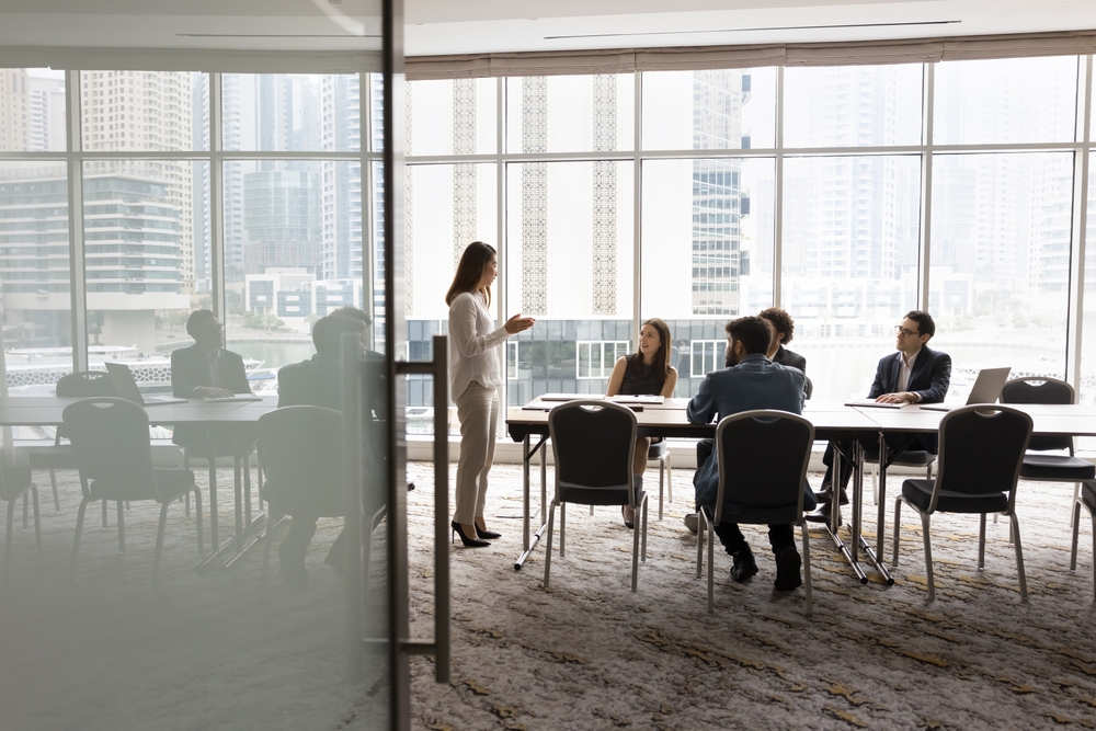 Stock image of a business team holding a meeting in a conference room.