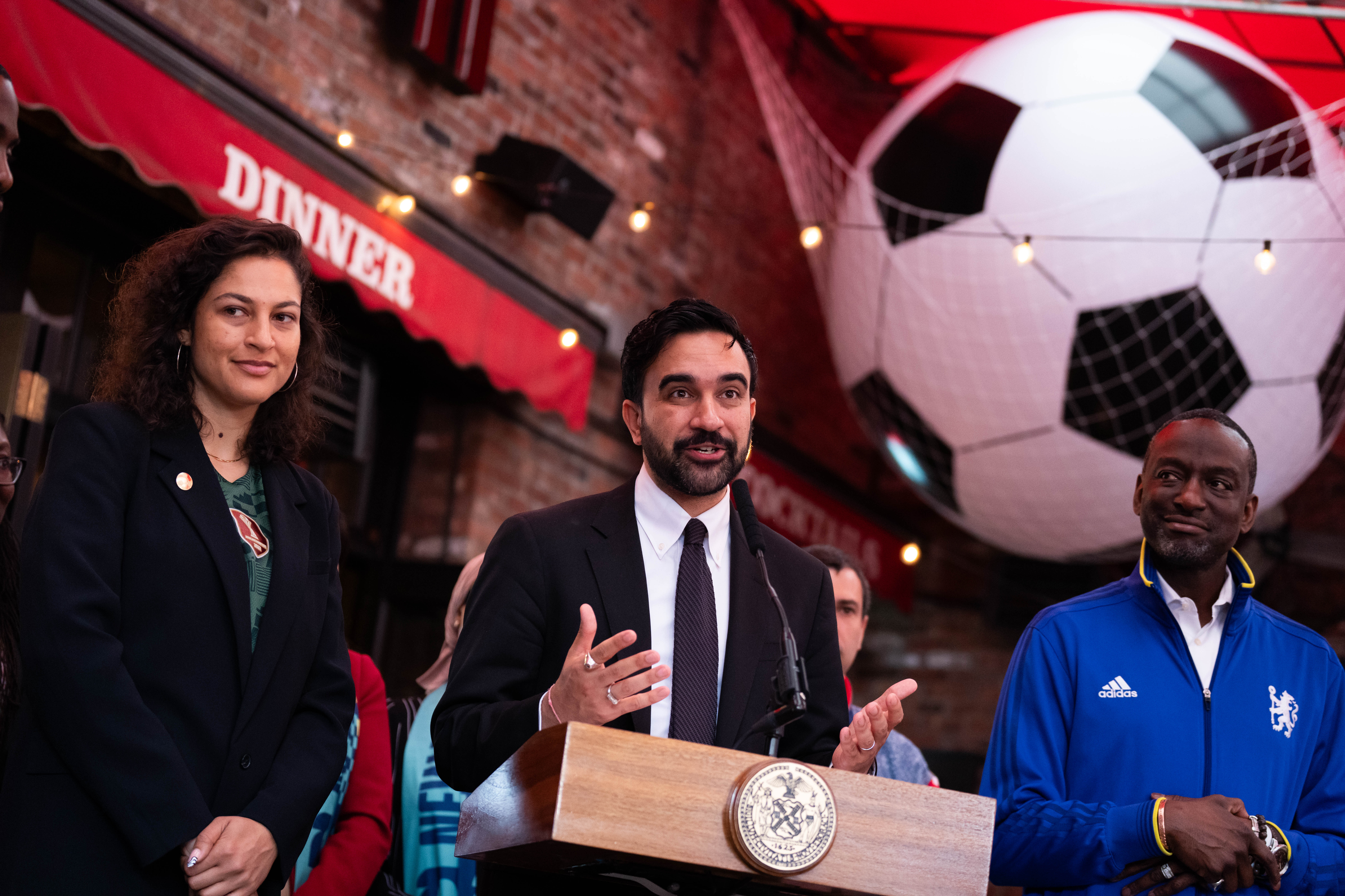 New York Mayor Zohran Mamdani, alongside NYC World Cup Czar Maya Handa, NYC World Cup Czar, left, and  New York council member Yusef Salaam, makes a World Cup soccer tournament announcement at Harlem Tavern, Thursday, May 21, 2026 in New York. 