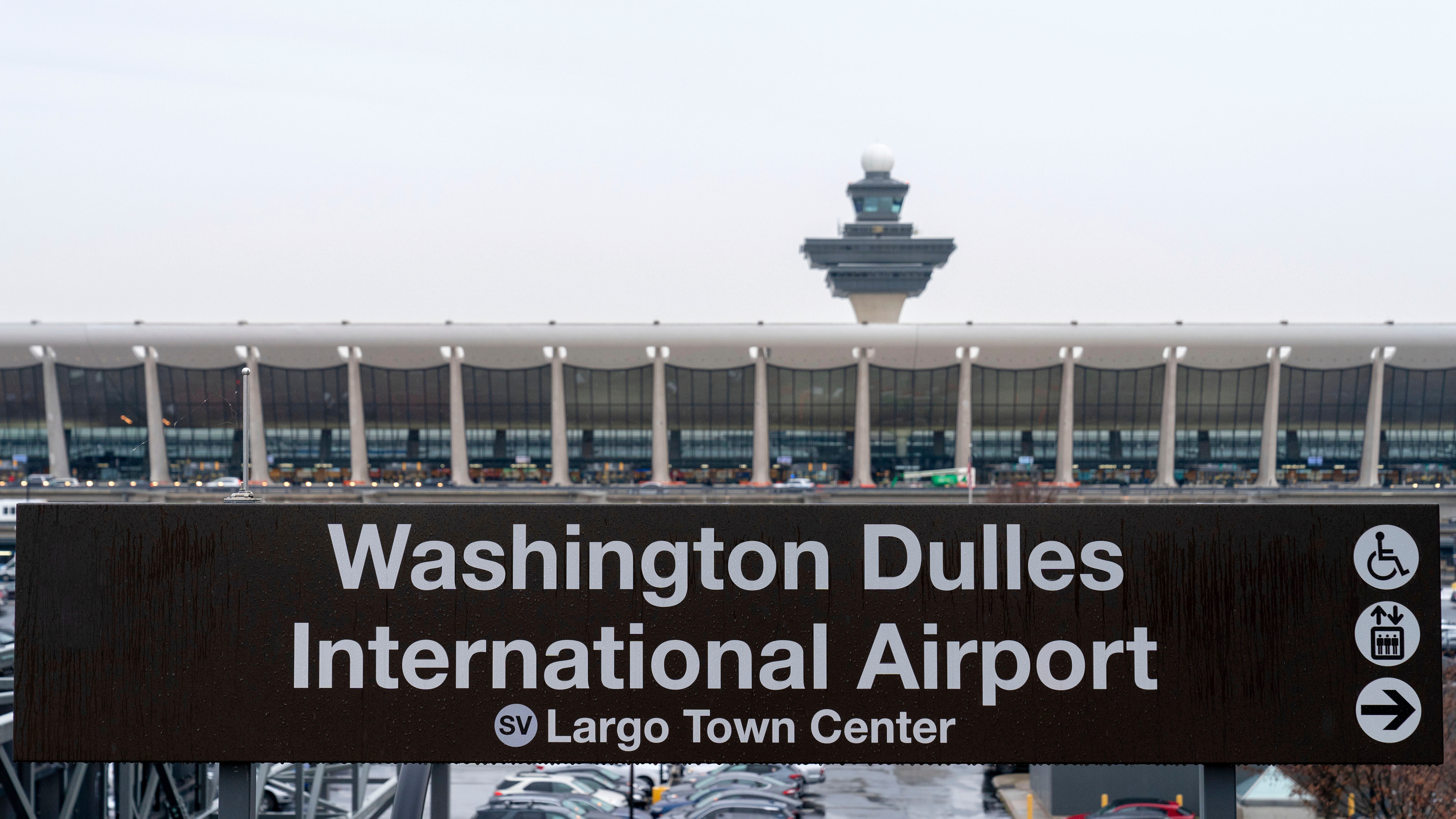 FILE - A sign of Washington Dulles International Airport station is seen during the opening of new Silver Line Extension at Washington Dulles International Airport, in Chantilly, Va., Nov. 15, 2022. 