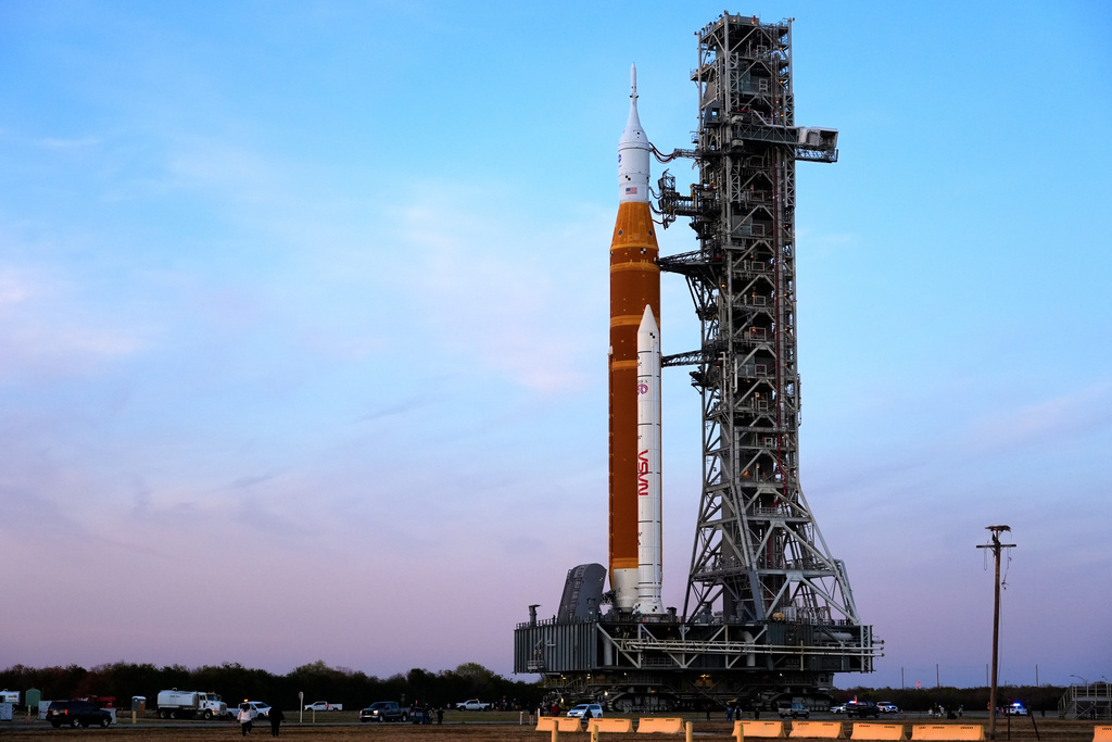 NASA's Artemis II SLS (Space Launch System) moon rocket with the Orion spacecraft slowly rolls back towards the Vehicle Assembly Building at the Kennedy Space Center, Wednesday, Feb. 25, 2026, in Cape Canaveral, Fla.