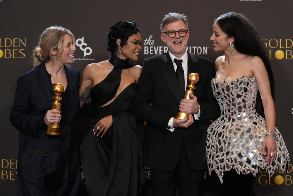 Sara Murphy, from left, Teyana Taylor, Paul Thomas Anderson, and Chase Infiniti pose in the press room with the award for best motion picture – musical or comedy for "One Battle After Another" during the 83rd Golden Globes on Sunday, Jan. 11, 2026, at the Beverly Hilton in Beverly Hills, Calif.