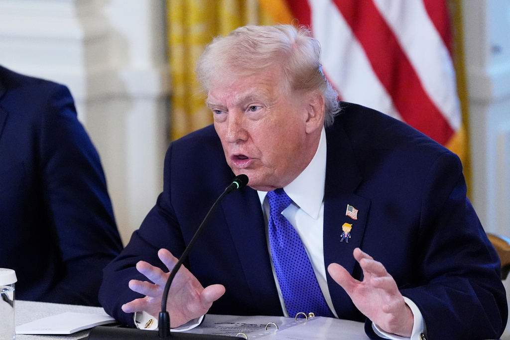 President Donald Trump answers reporter questions during a meeting with oil executives in the East Room of the White House, Friday, Jan. 9, 2026, in Washington. 