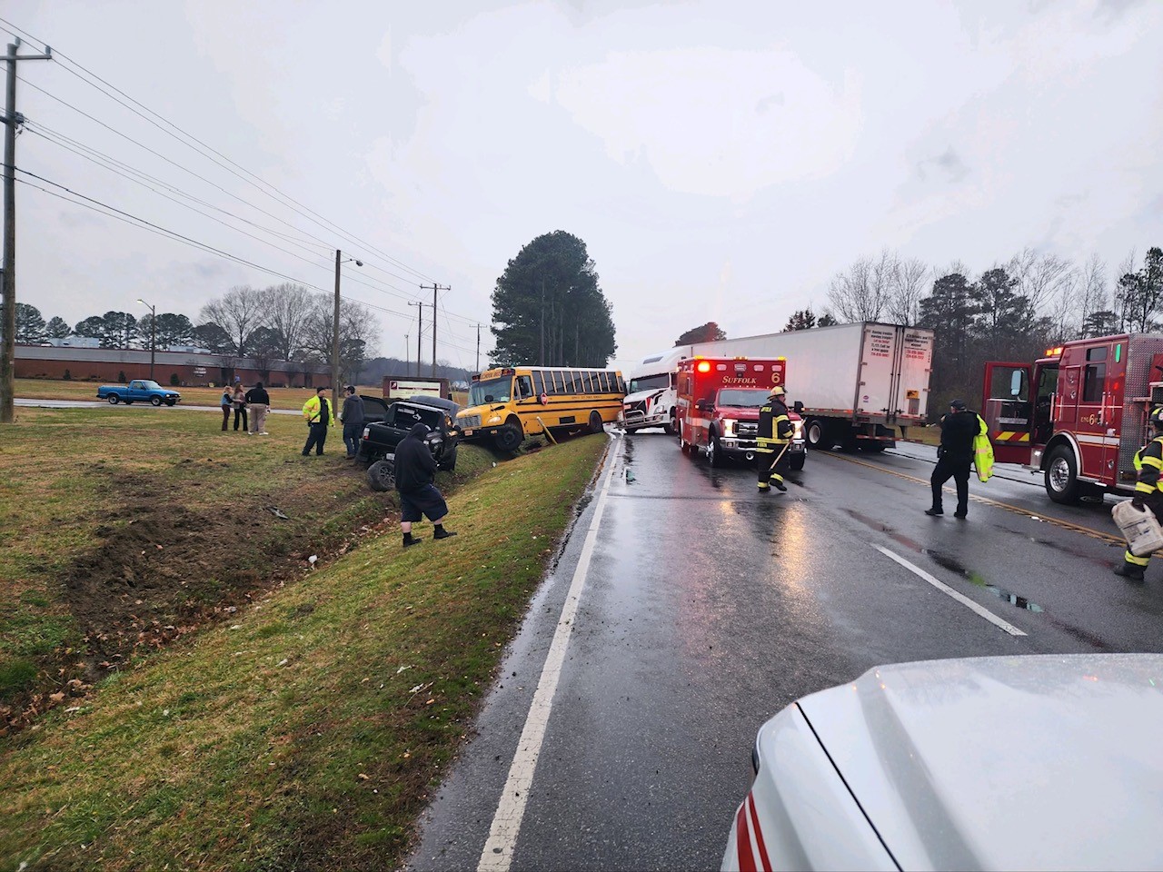 Authorities respond to crash involving semi, bus in Suffolk; No one hurt