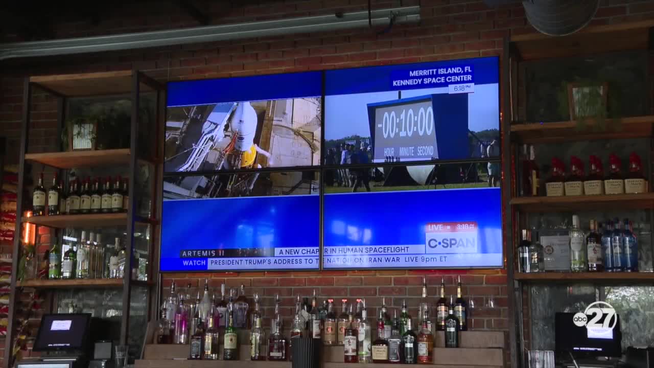 Tallahassee bar patrons pause their night out to watch the historic Artemis II rocket launch together