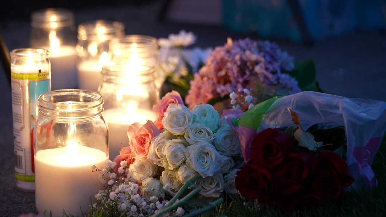 Candles and flowers at the Charlie Kirk vigil in St. Johns