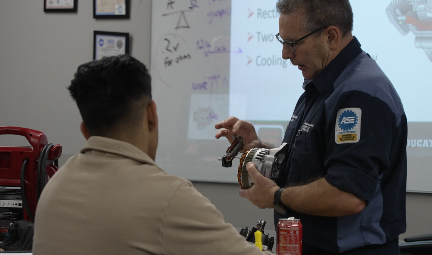 Bob Gentleman, an instructor at Metropolitan Community College, guides students through a lesson on alternators.