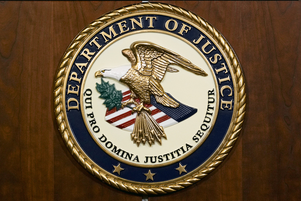 The seal of the Department of Justice.