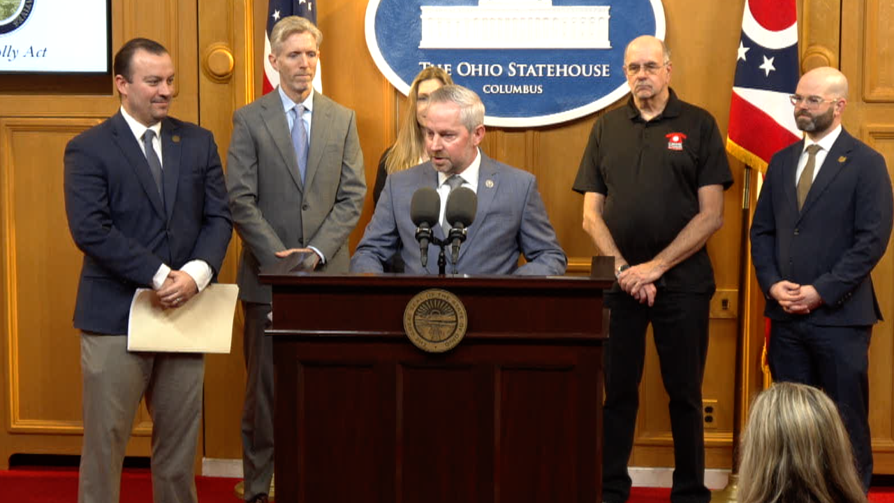 Jeff LaRe and D.J. Swearingen speak at a press conference about bail reform
