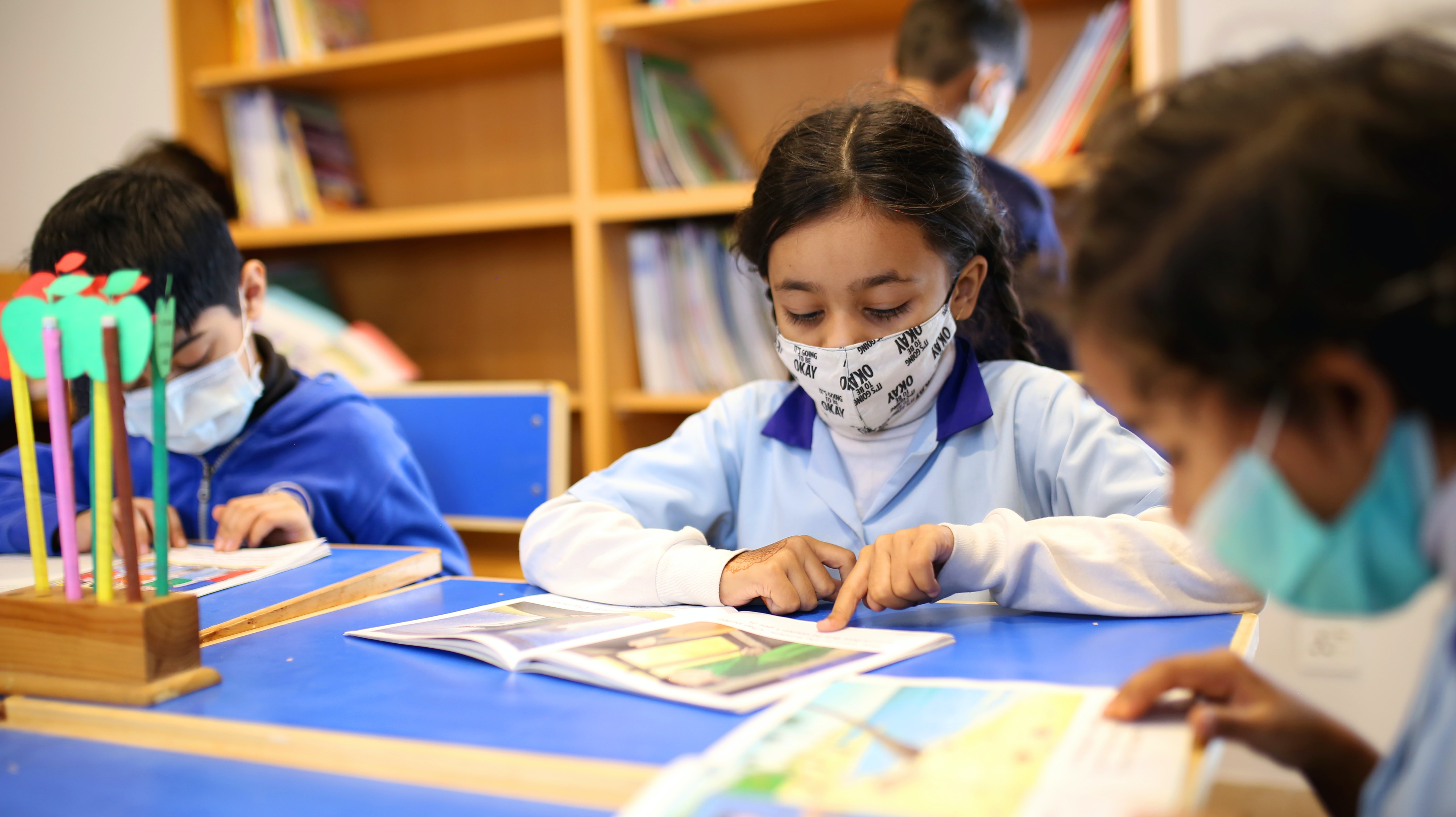 Kids wearing masks in classroom 